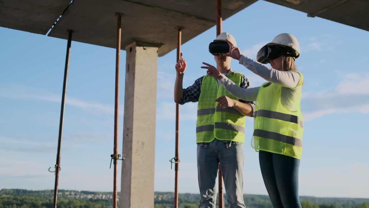 Waist up portrait of two modern construction workers using VR gear to visualize projects on site copy space