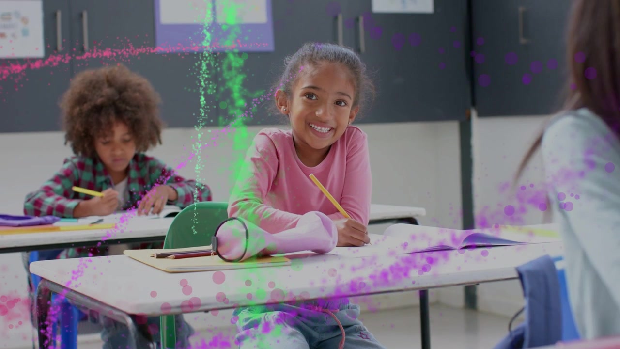 Girl writing in class after right cue, looking up smiling as pink green streaks revealing notebook