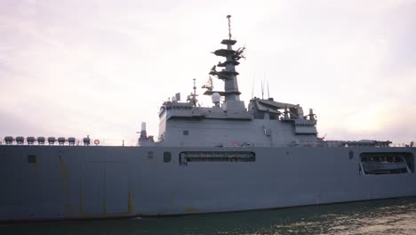 slow motion shot over japanese maritime self defense force navvy, kure bay