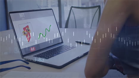laptop displaying nft art and stock chart over financial data animation
