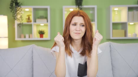 worried and stressed young woman is panicking, thinking what to do.