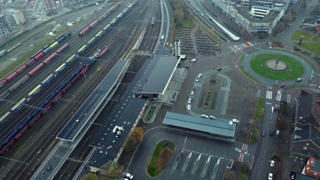 Aerial view of a train station and surrounding urban area