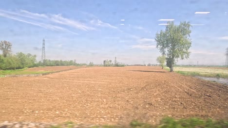 scenic fields and landscapes from a train