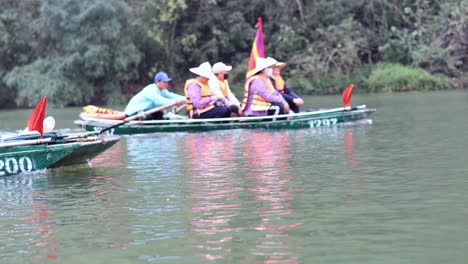 team rowing boat with flag on river