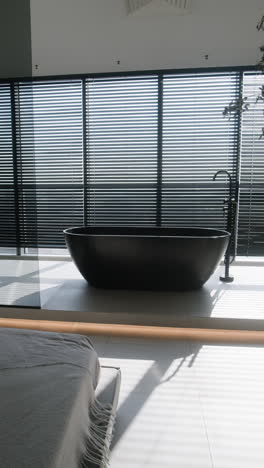 modern black bathtub with balcony view