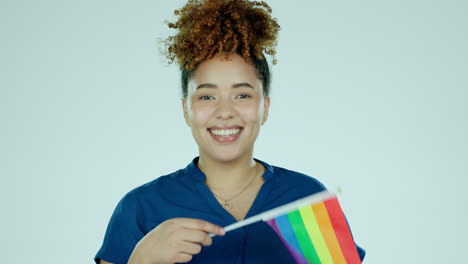 face, woman and rainbow flag in studio for pride