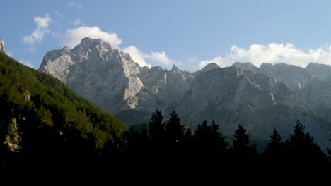 time lapse clouds over mountain peak in sunset, ojstrica in kamnisko savinjske alpe, slovenia, logarska dolina, european alps