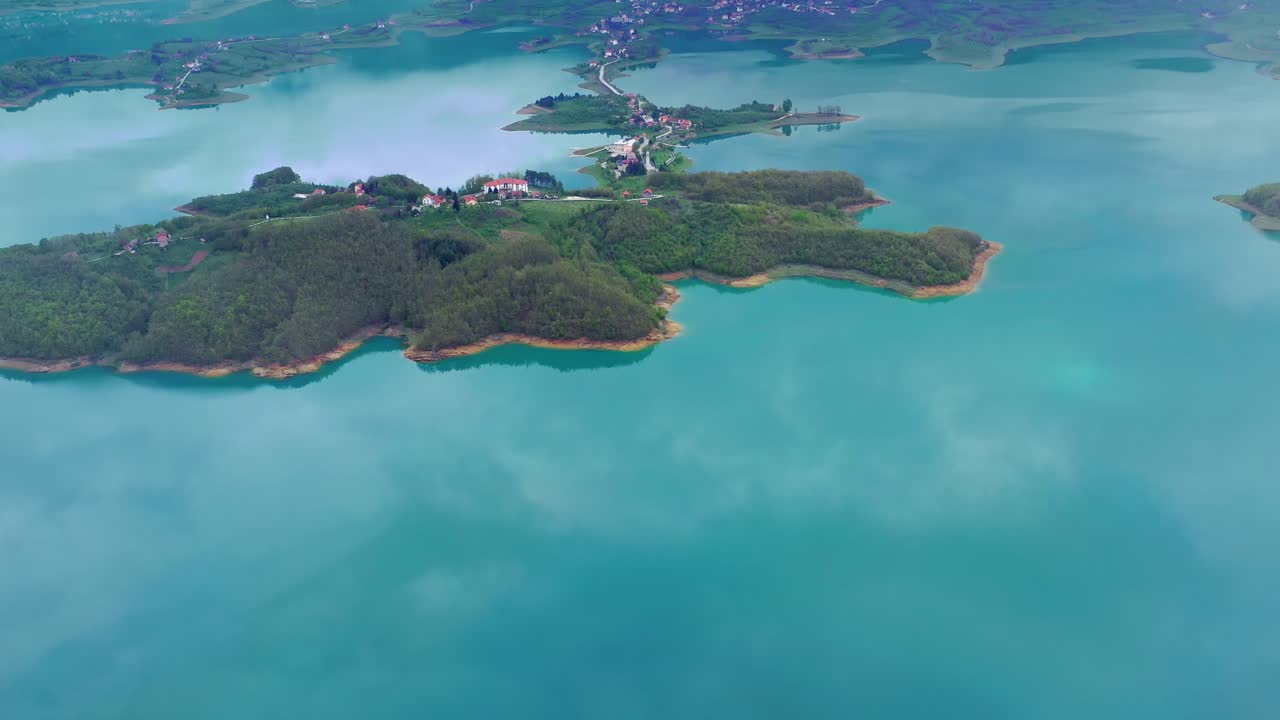 Panoramic view of islands, peninsulas in the Rama Lake on foggy day