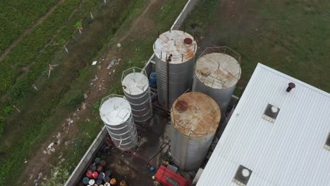 aerial view of industrial area with large storage tanks