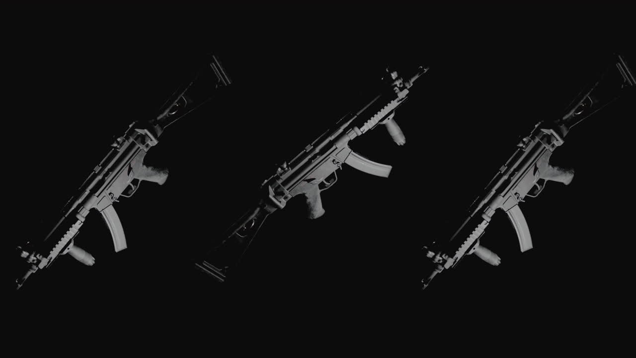 Machineguns on the dark background rotate in slowmotion
