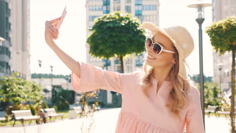 young woman taking a selfie outdoors