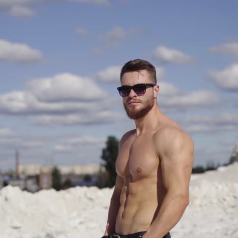 attractive young muscle man outdoors