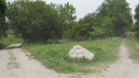 drone approaching a natural rock landmark in a low altitude in the woodlands of tsarichina hole, a place in bulgaria known for some paranormal activities