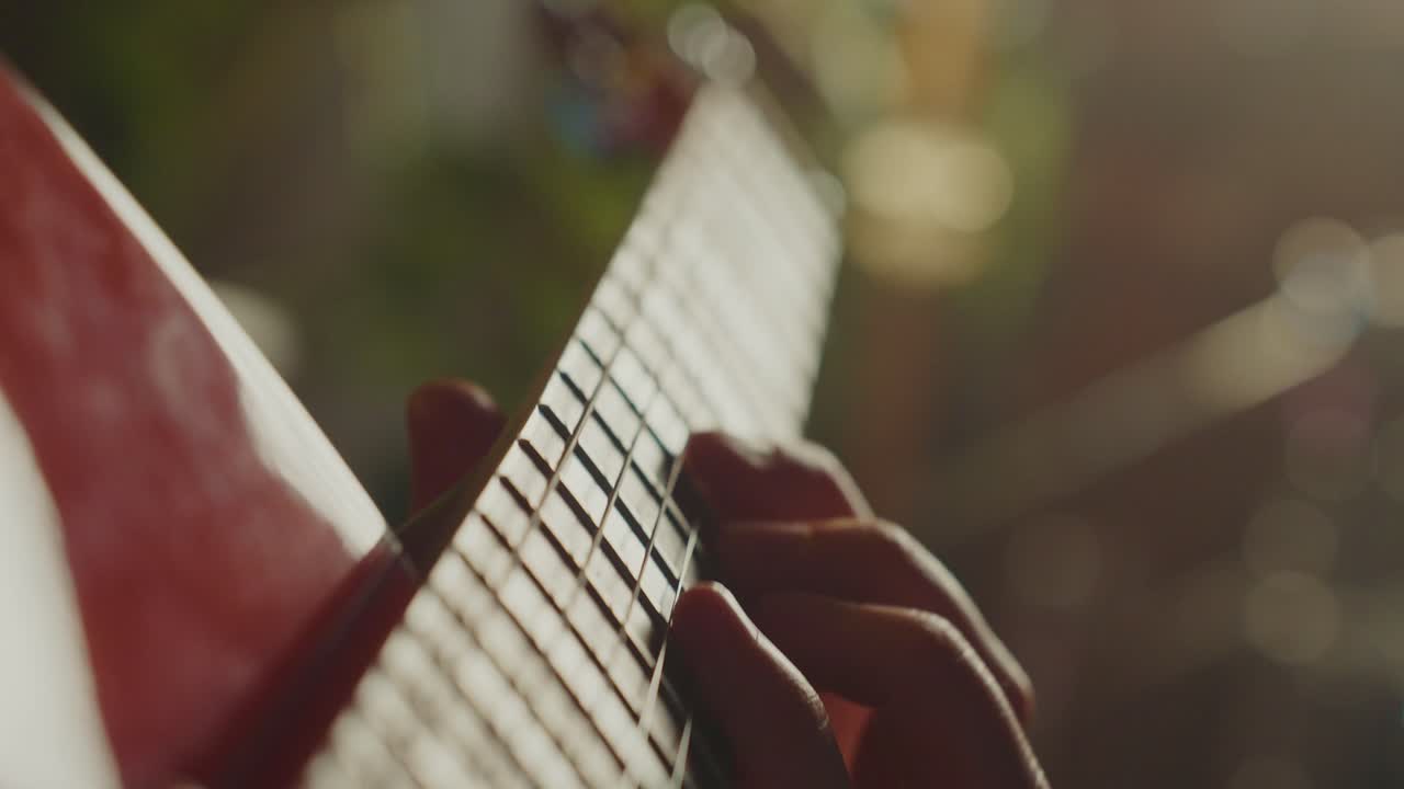 Close up of a person playing an acoustic guitar