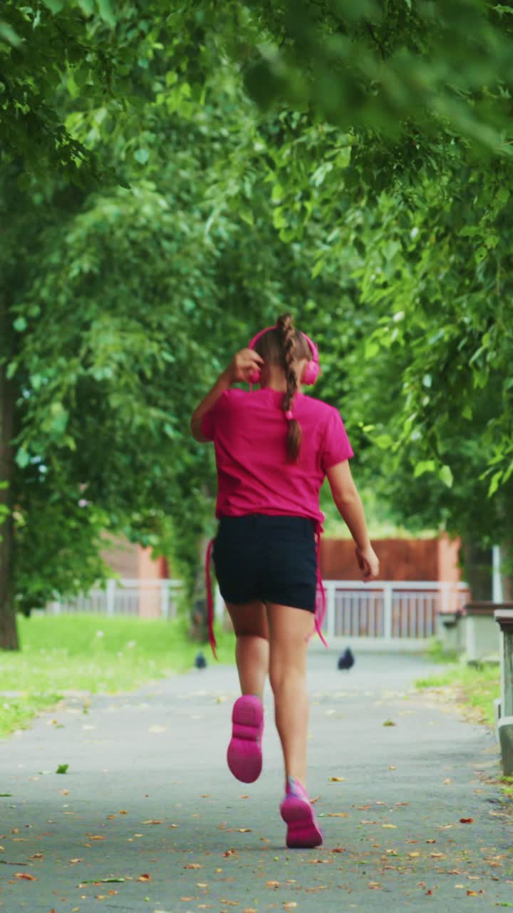 A Young Girl Enjoying Her Walk with Headphones in a Lush Green Landscape, Capturing the Essence of Joy and Freedom in Nature