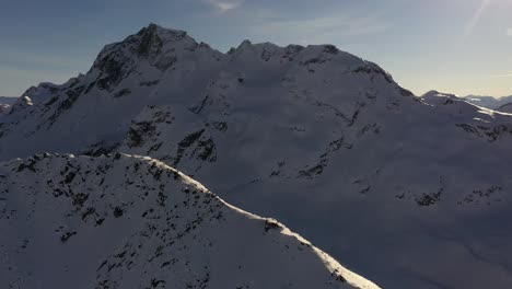 summit of chief pascall with joffre peak in the background in the winter