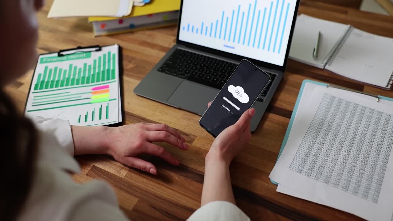 Analyzing data on laptop and mobile phone