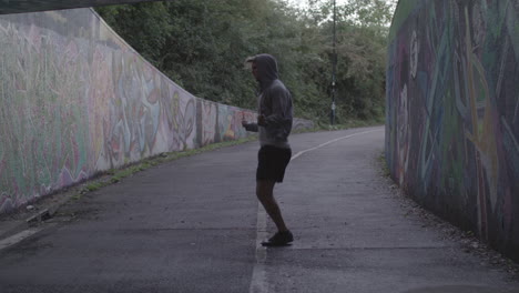 Wide-Shot-of-Athletic-Man-Jumping-Rope-in-an-Underpass-In-Slow-Motion---Ungraded