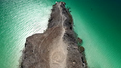 aerial view of rocky beach with labyrinth near playa balandra in baja california sur in mexico