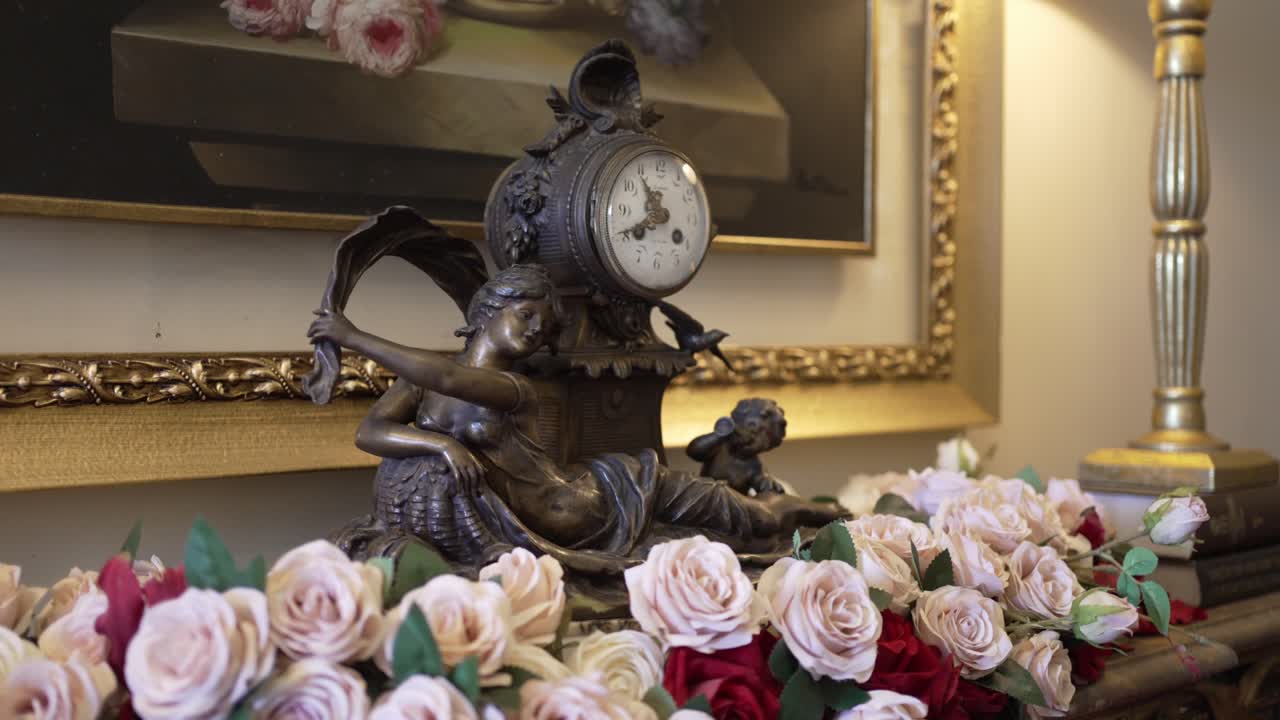 Antique Clock and Roses on a Table