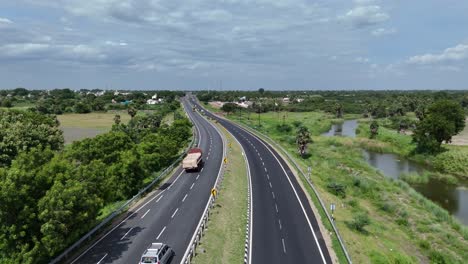 expansive highway cutting through the countryside in india