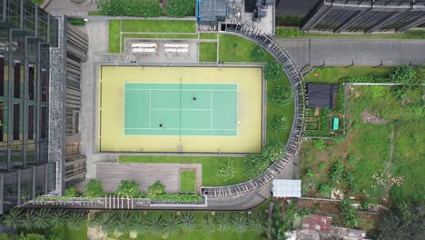 rooftop tennis court in urban setting