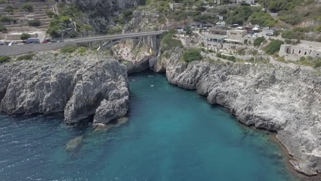 aerial flyback ascending from ponte ciolo or ciolo bridge in puglia, italy