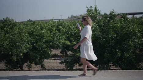 woman walking in an orchard