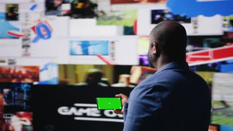 african american user holding a phone with isolated mockup display