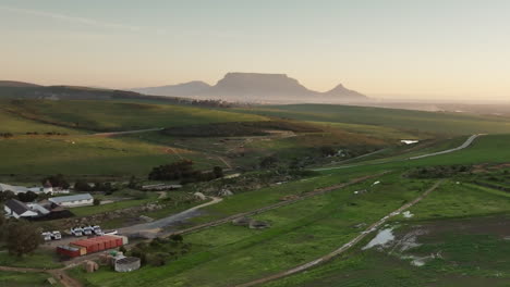 aerial view of a farm with table mountain in the background