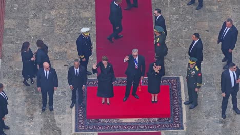 official ceremony with dignitaries on a red carpet