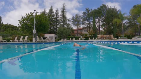 man swimming laps in a pool