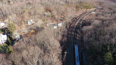 and aerial view over a silver train on a sunny day