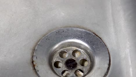 kitchen sink with water drop dripping, background loop