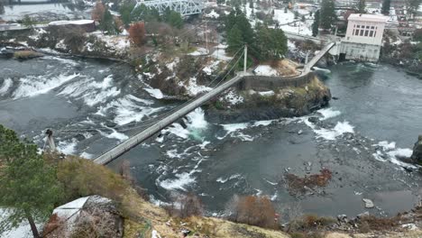 aerial view of a pedestrian bridge that connects downtown spokane to canada island in riverfront park