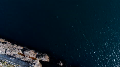 Aerial-view-over-Durdle-Door-rock-formation-in-sea