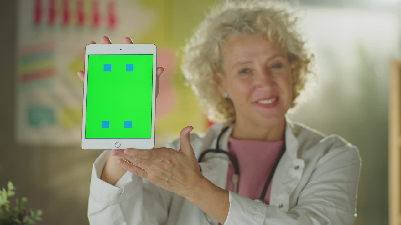 Doctor Presenting a Tablet with Green Screen