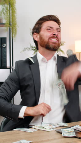 Middleaged businessman tosses dollar cash makes money rain laughs shares donation with others big