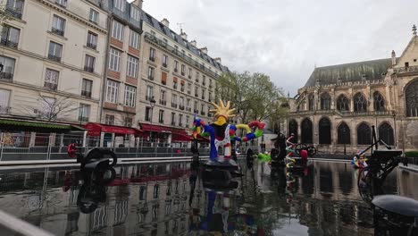 vibrant parade with flags near a gothic cathedral