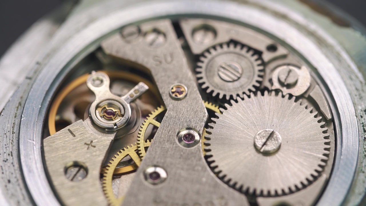 Close-up of Intricate Mechanical Watch Movement with Gears Turning