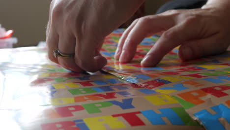 mother wrapping a gift for her child's birthday party