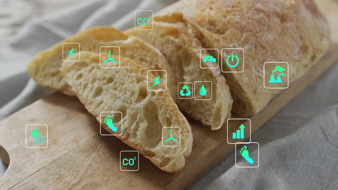 Sliced bread on wooden board with eco-friendly icons overlay animation