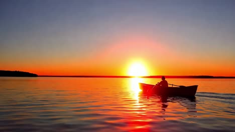 sunset canoeing on a calm lake