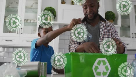 Animation-of-recycling-signs-over-african-american-father-and-son-recycling-plastic