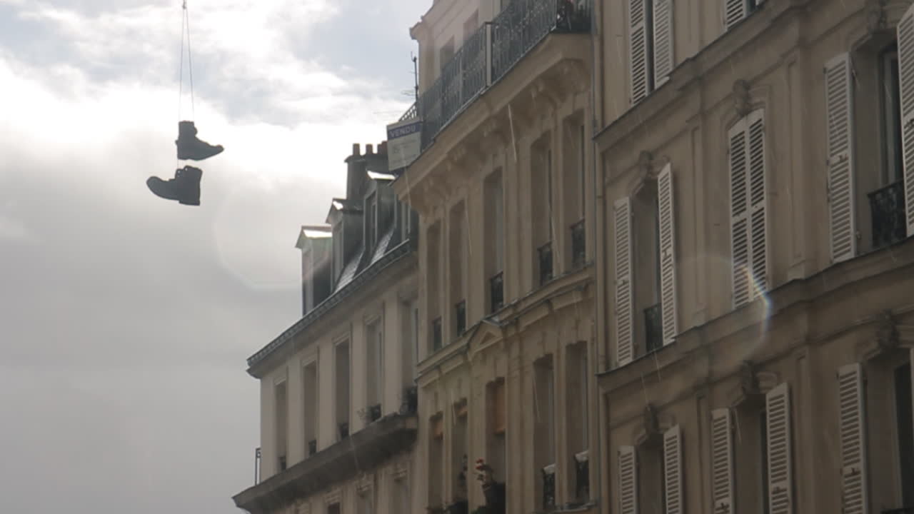 Shoes hanging on a building facade