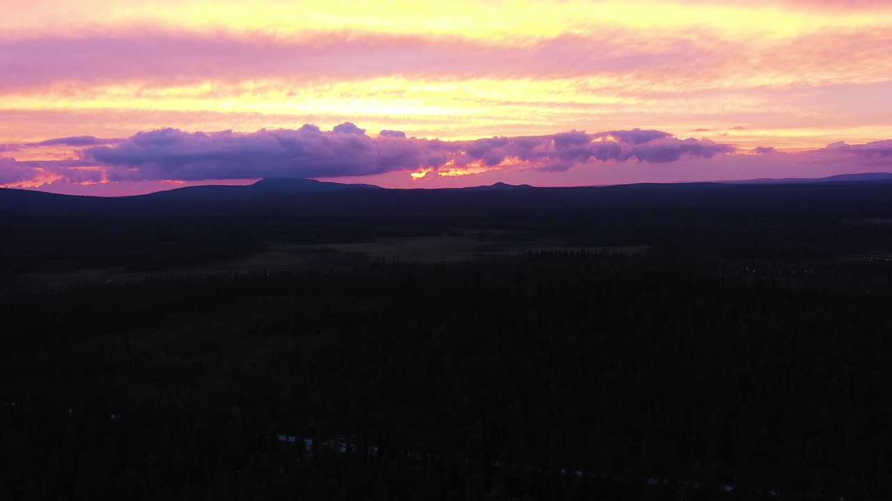Colorful purple pink sunset over mountains in Kiimaselkä, Finland