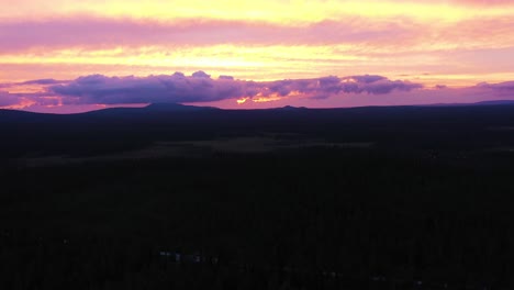 colorful purple pink sunset over mountains in kiimaselkä, finland