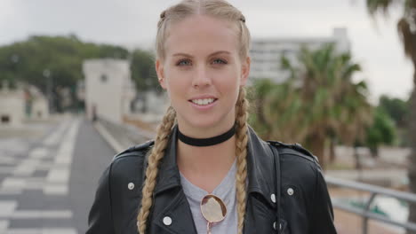 portrait-beautiful-young-blonde-woman-smiling-confident-enjoying-relaxed-lifestyle-attractive-caucasian-woman-wearing-leather-jacket-in-urban-city-background