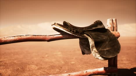 horse saddle on the fence in monument valley