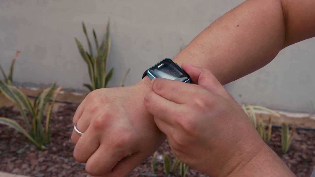 Man Using A Digital Smartwatch During Workout